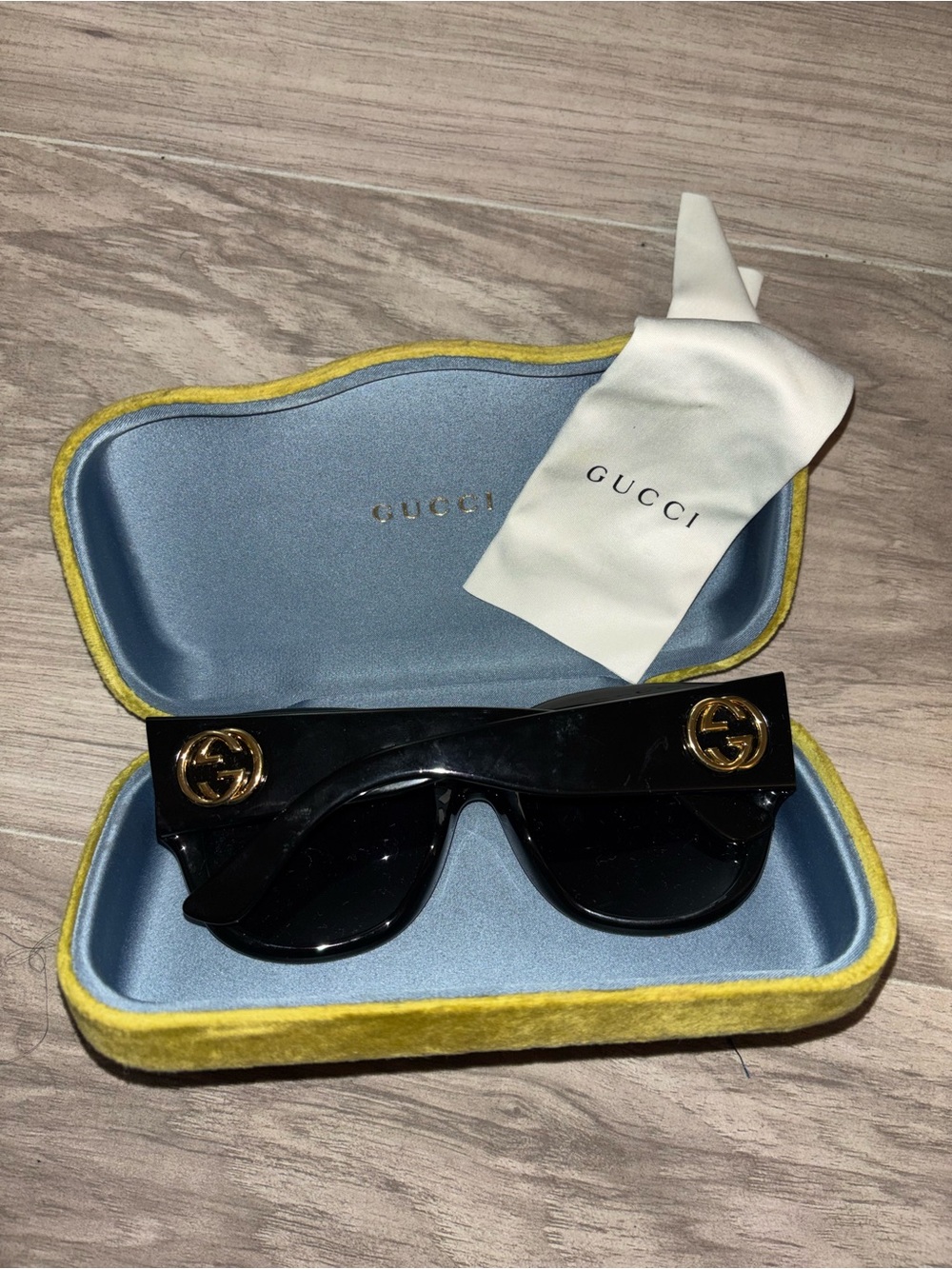 Gucci Black Shield Sunglasses with Gold Logo Accents